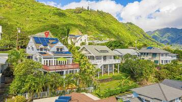 A coastal residential area with houses featuring balconies and solar panels.