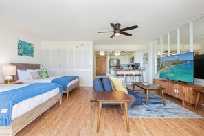 A hotel room with two beds, a dining table, a TV, and a kitchenette. - Skyline-lagoon and Fireworks Magic From the Ilikai W/top-tier Amenities (Honolulu)