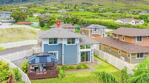 A residential area with houses, a gazebo, and a red location marker. - Ocean-sunset Views Home in Gated Makaha Community W/great Amenities (Waianae)