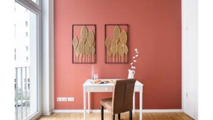 A room with a white desk, a brown chair, and two wall-mounted decorative panels. - Spacious 4-Bedroom Apartment with Balcony & Easy Check-In (Berlin)