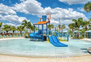 A water park with slides and a pool. - Upstay Modern Home Near Disney With Pool (Kissimmee)