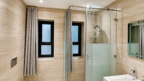A modern bathroom with a glass-enclosed shower, a white bathtub, and a large mirror above the sink. - PREMIUM EXPERIENCE - MODERN VILLA WITH EXCEPTIONAL COMFORT (مراكش)