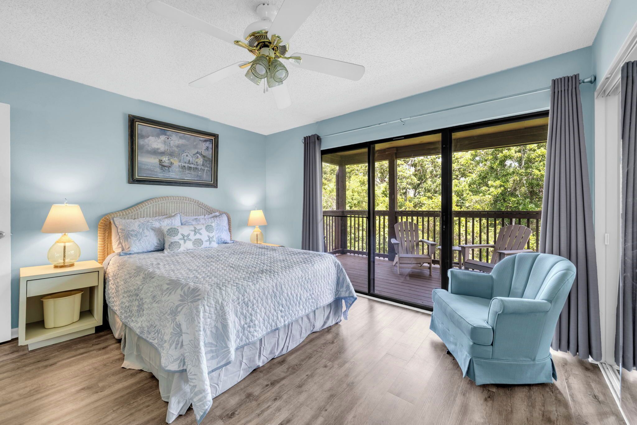 Welcome to Coral Cove! Wake up to peaceful treetop views from the spacious primary bedroom, featuring a queen bed, a Smart TV, plenty of closet space, and direct access to your private covered balcony.