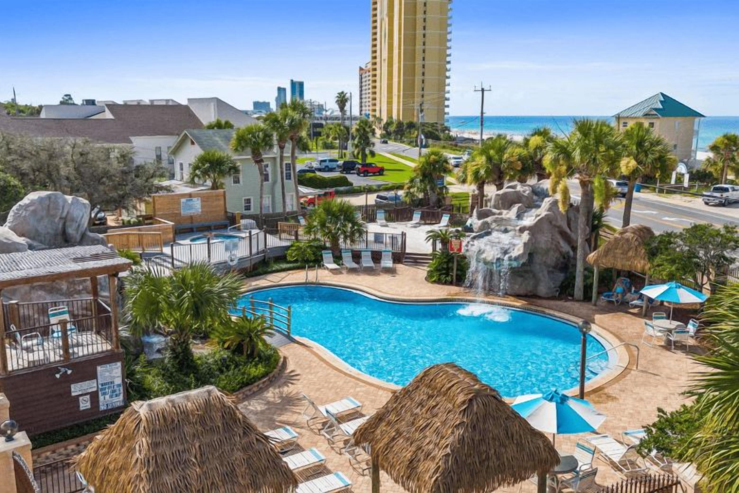 Soak up the Florida sunshine at Portside Resort’s tropical pool, complete with a rock waterfall, plenty of loungers, and beautiful views toward the Gulf. The beach is just a short walk away!