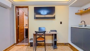 A compact kitchen with a built-in stove, a sink, and a countertop. - Primavera Lofts (Medellín)