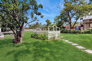 A well-maintained lawn with a white gazebo, surrounded by trees and a clear sky. - Beautiful Two-level Farmhouse w/ Garden Views, Free Wifi, & Outdoor Dining Area (Fredericksburg)