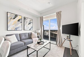 Living area - Sleek 2BR Condo | City View | Pool, Gym & Bowling (Kitchener)