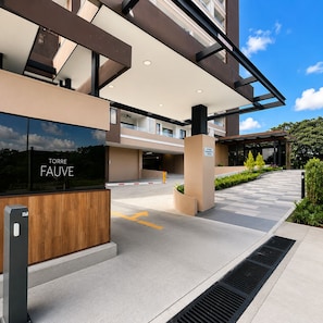 A modern building entrance with a sign reading 'TORRE FAUVE' and a gated driveway. - Las Ramblas 3 Bedroom Penthouse (Santa Tecla)