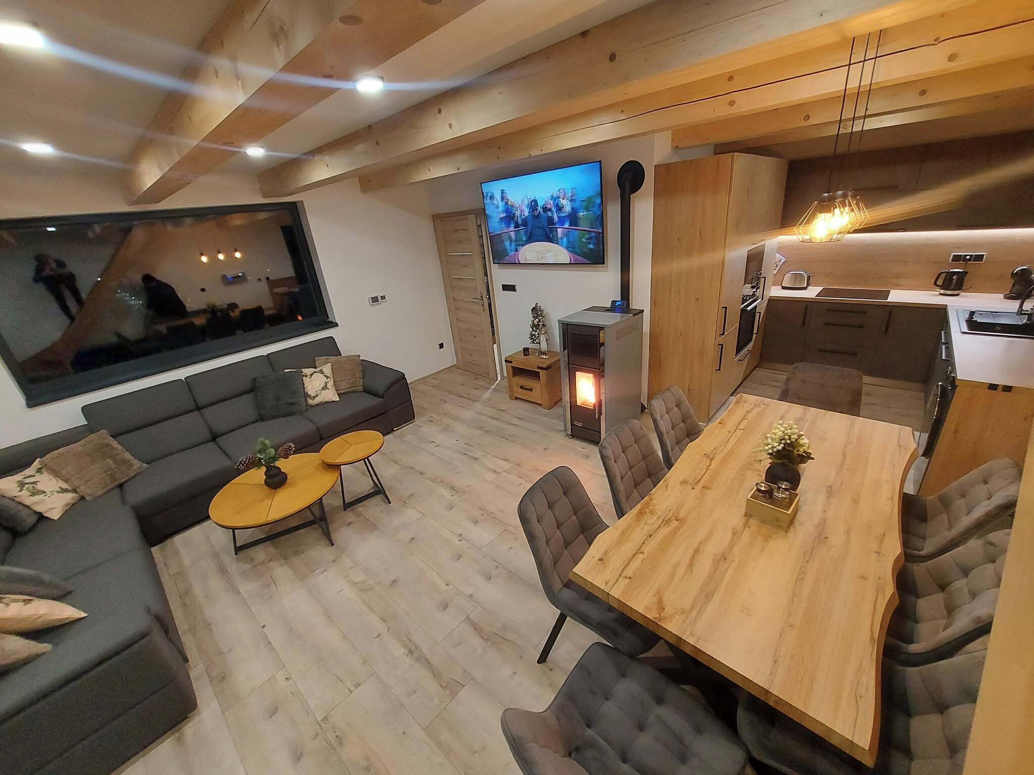 A modern living room with a sofa, coffee table, and TV.