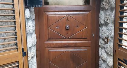Stone chalet in a medieval village, enchanting view of the lake and Alpi Apuane