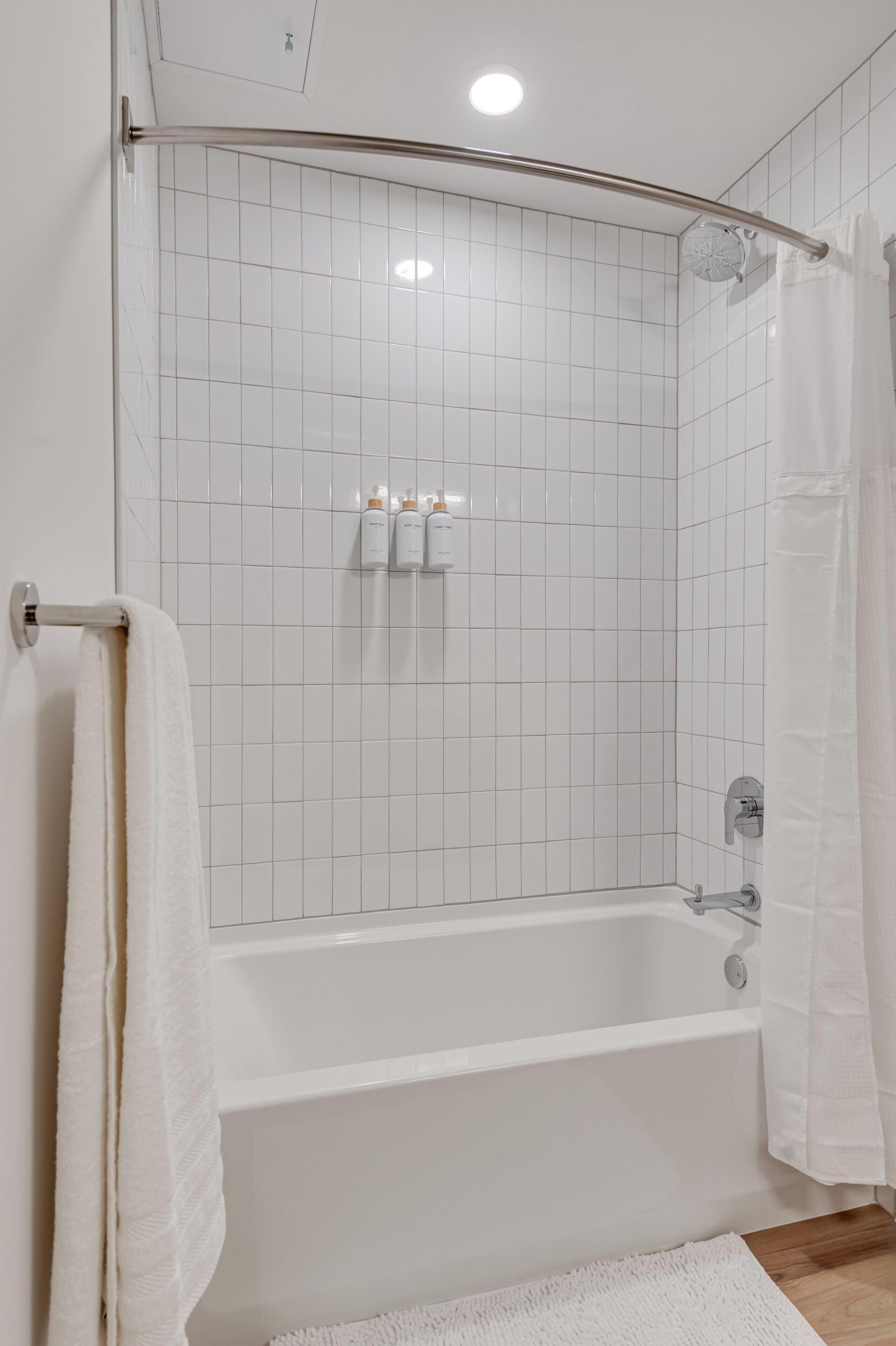 Shower, hair dryer, towels, shampoo