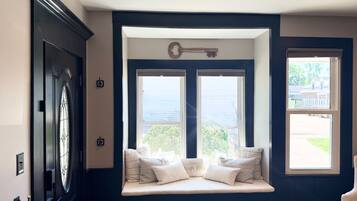 A bay window with two windows, a key above it, and a door with a keyhole to the left.