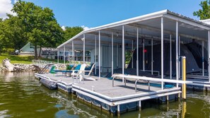 A covered dock with lounge chairs and a pool table. - The Ranch of Monkey Island [Private Dock] (Afton)