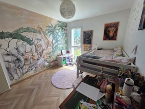A child's bedroom with a mural, bunk bed, and various toys. - A 4-bedroom family home located between Bayonne, Biarritz, and the Landes region. (TARNOS)
