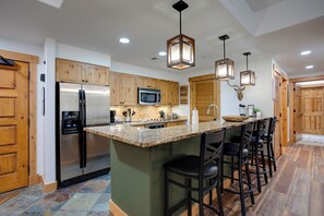 Your fully equipped mountain kitchen features granite counters, stainless appliances, and a spacious island perfect for morning coffee or evening meals with loved ones. - AL4203 | Beautiful and Professionally Decorated | 10 Hot Tubs | Air Chilling (Steamboat Springs)