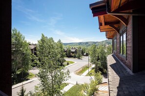 A residential area with a view of a mountain range. - BL6304 | Private Roof Top with Hot Tub | Stunning Condo | Air Chilling | Pools (Steamboat Springs)