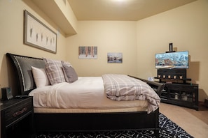 A bedroom with a bed, a TV, and a fireplace. - BL6307 | Vaulted Ceilings | Amazing Views | Air Chilling | 10 Hot Tubs (Steamboat Springs)
