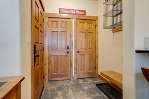 A wooden double door with a sign above reading 'Home Ski Home.' - CL3103 | Newly Modern| Close to Skiing | A/C | 10 Hot Tubs (Steamboat Springs)