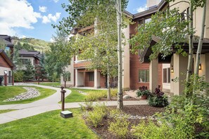 A residential area with modern houses, a paved walkway, and well-maintained landscaping. - CL3209 | Newly Listed | Close to Skiing | Perfect for Couples | A/C (Steamboat Springs)