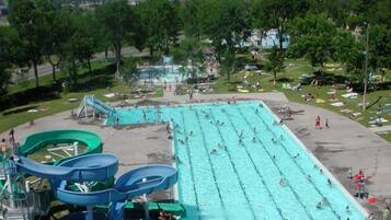 A water park with multiple swimming lanes, water slides, and a large pool area.