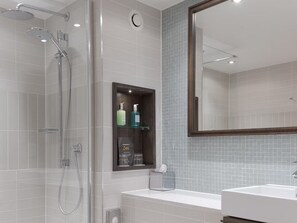 A modern bathroom with a glass-enclosed shower, a built-in medicine cabinet, and a large mirror above the sink. - 1BR Suite w/ Sofa Bed, Kitchen & Free Breakfast (West Drayton)