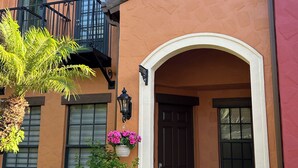 A building with a balcony, a door, and a window. - OLE’ Lely resort. Beautiful 3-bedroom 2.5 bath townhome. Resort-style living! (Naples)