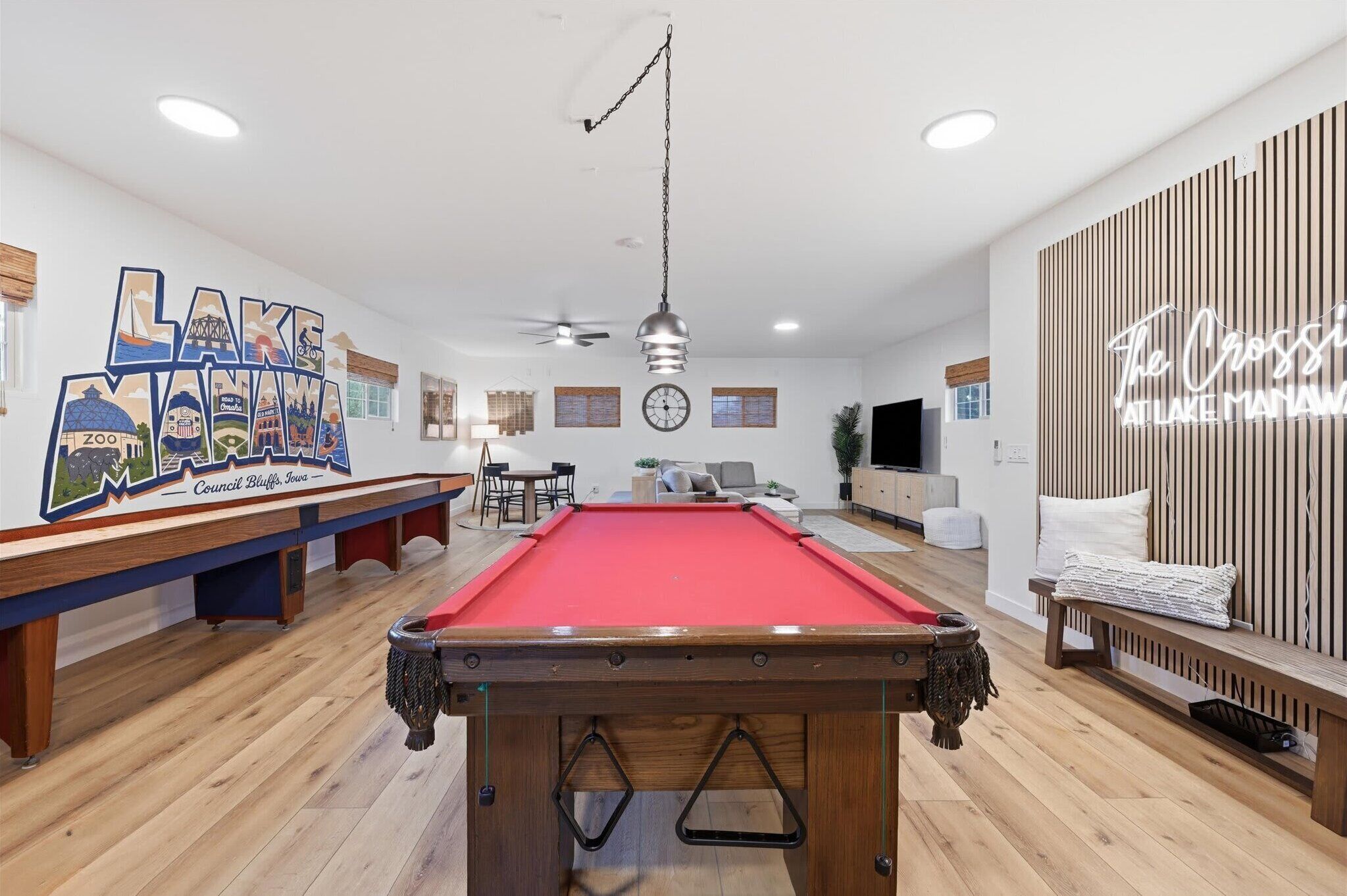 Massive game room with instagram ready feature wall, pool table, shuffleboard and more 