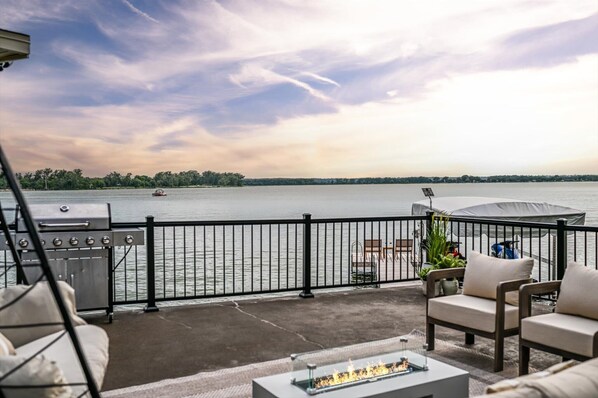 Outdoor living is a highlight at The Crossing—relax on the lakefront patio with unobstructed Lake Manawa views just steps from the water.