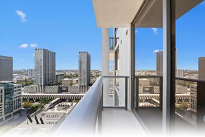 A high-rise building with a view of a cityscape. - The Crosby | Apt w/ Water View | Gym & Pool Access (Miami)