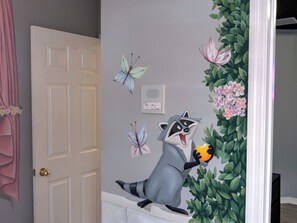 A door with a raccoon character and butterflies on the wall. - Palms & Pixie Dust Villa - Pool (Davenport)