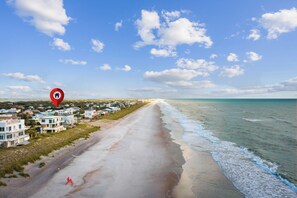 A coastal road leading to a beach with houses on the left and the ocean on the right. - Vilano Beach | Private Pool + Pickleball + Hot Tub (St Augustine)