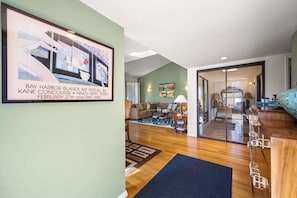A spacious living area with a sofa, coffee table, and artwork on the wall. - Sunrise Racquet Club Villa (Palm Springs)