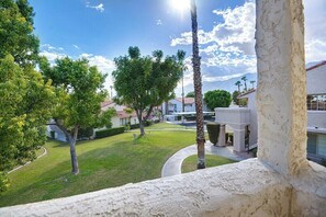 A residential area with houses, a well-maintained lawn, and a clear sky. - Mesquite Comfort Phase 2 (Palm Springs)
