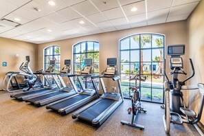 A fitness center with treadmills, ellipticals, and stationary bikes. - Princess/StarWars 5-bedroom house in Orlando near Parks (Kissimmee)