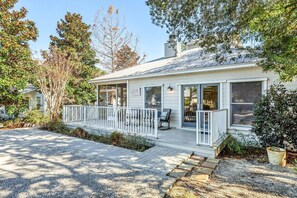A single-story house with a covered porch, a small deck, and a front yard. - L'escapade, Old Seagrove, Near Seaside, Private Heated Pool, Close to Beach (Seagrove Beach)