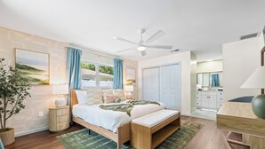 A modern bedroom with a bed, bedside tables, a ceiling fan, and a view of the outdoors. - Full Gym ● 7min to IMG / 16min to AMI ● Sauna & Cold Plunge ● Sport Court ● Pool (Bradenton)