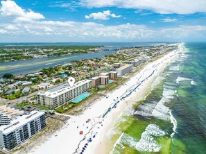 A coastal hotel with multiple floors, a pool, and a beach view. - Gulf View Condo with Shared Pool & Beach Access (Fort Walton Beach)