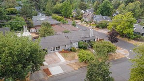A residential area with houses, a driveway, and a street. - Walk-to-UO Retreat with Private Patio (Eugene)