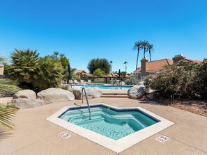 A swimming pool area with a hot tub, lounge chairs, and palm trees. - Charming Palm Desert Hideaway in Silver Sands club - Pool, Tennis & Sunshine! (Palm Desert)