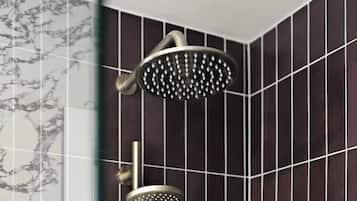 A showerhead with a curved design and a smaller handheld showerhead below it.