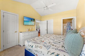 A bedroom with a bed, dresser, ceiling fan, and a TV on the wall. - Magnolia North 4834-304 (Myrtle Beach)