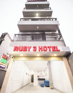 The exterior of the Ruby 3 Hotel with a prominent sign and a modern design. - RUBY 3 HOTEL (Thien loc)