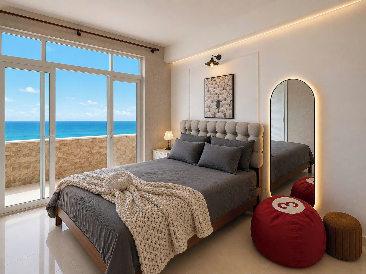 Un dormitorio moderno con una cama grande, vistas al océano y una playa cerca.