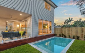 A two-story house with a swimming pool, a patio with outdoor furniture, and a wooden fence. - WELCOME HOME (Chapel Hill)