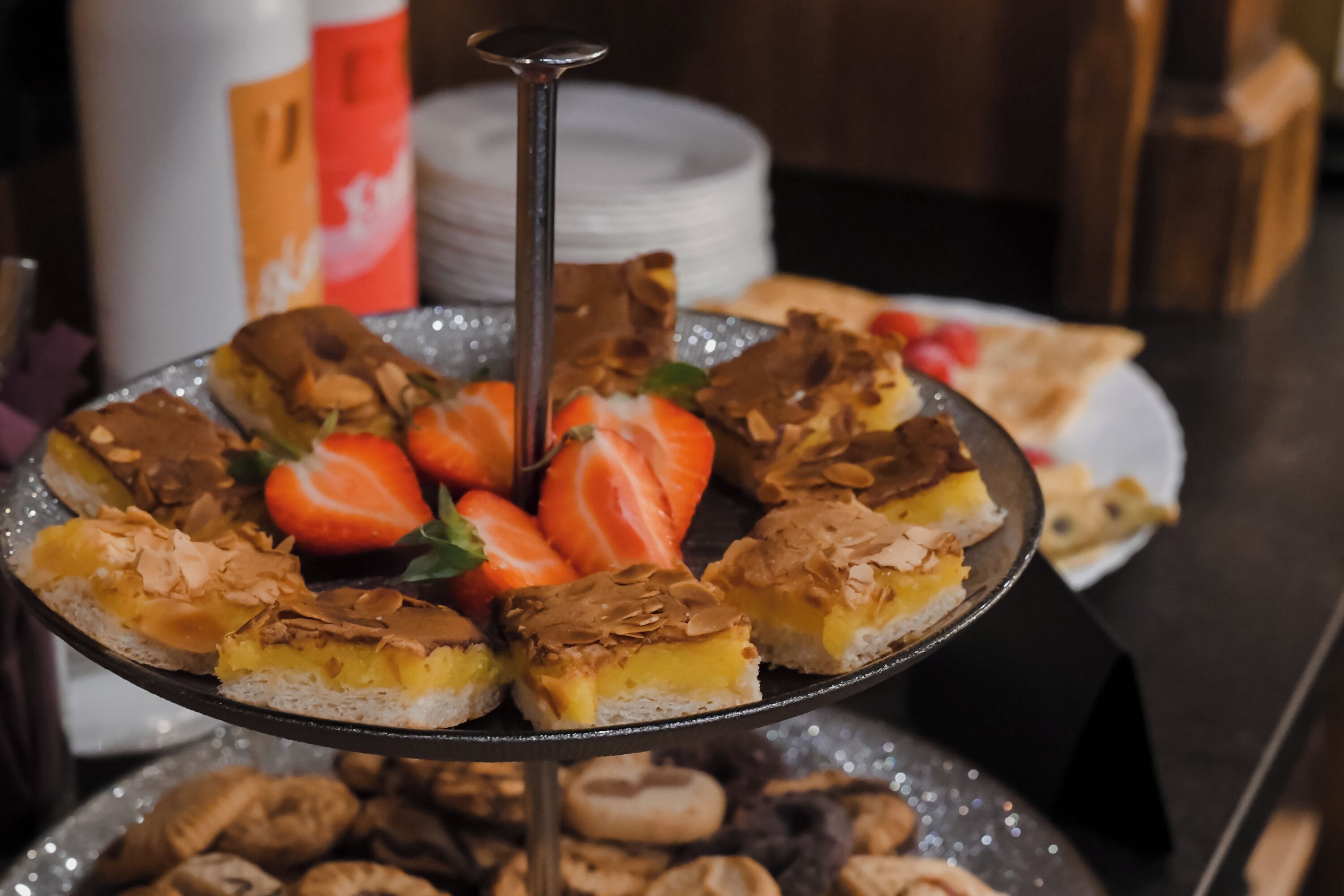 A dessert tray with pastries and strawberries.