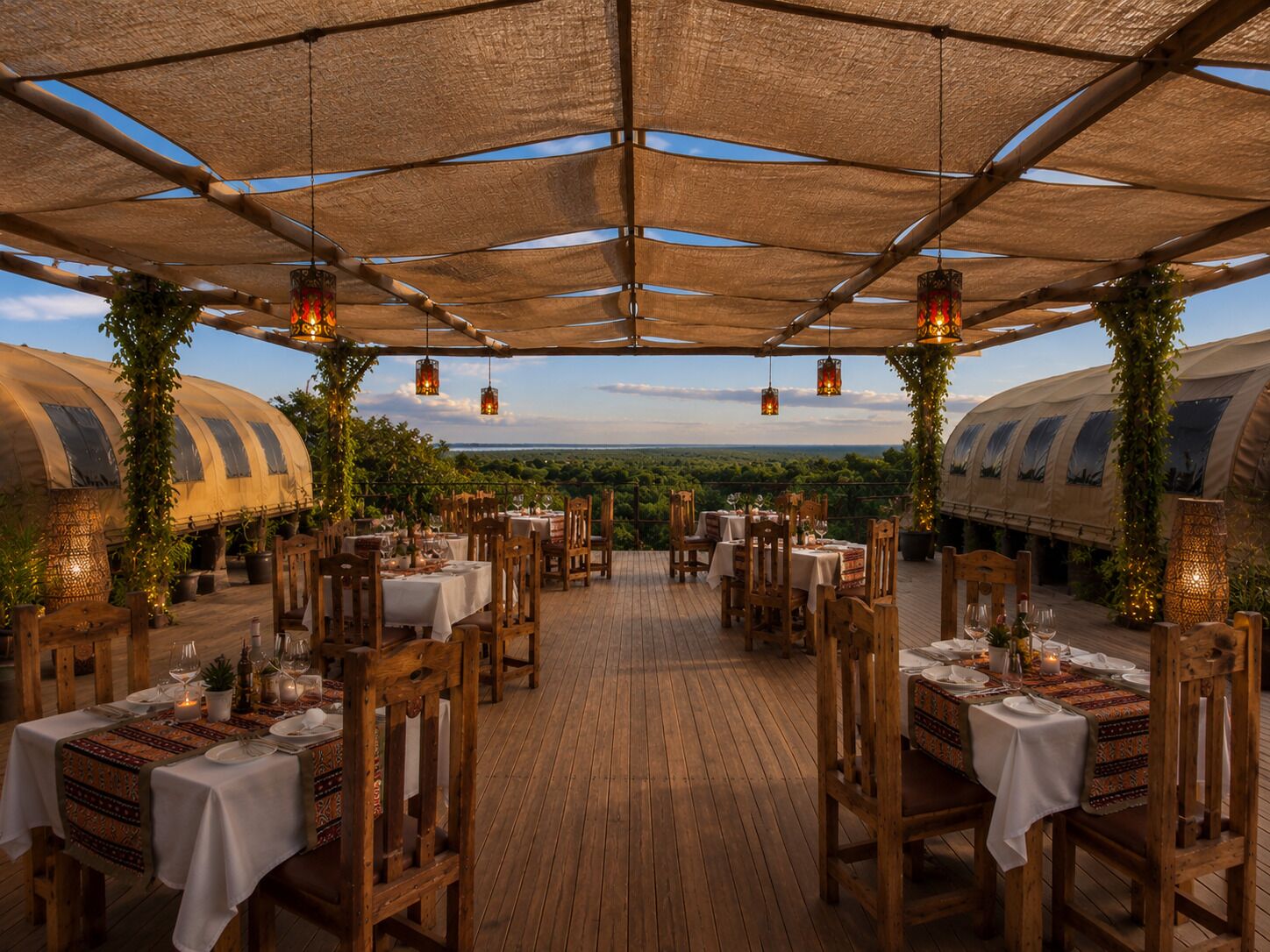An outdoor dining area with tables and chairs, covered by a canopy, and surrounded by greenery.