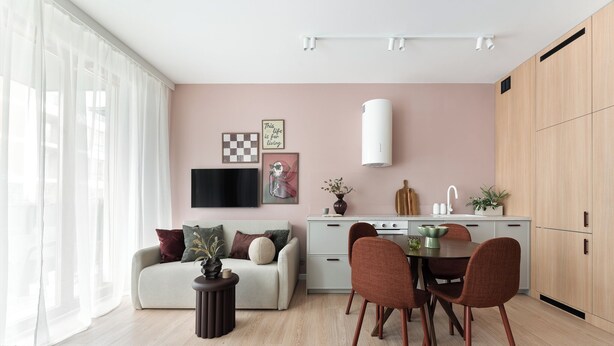 A modern living space with a sofa, dining table, chairs, and a kitchen area. - Studio 54, Holzera, Wilanów, Warsaw (Warszawa)