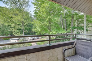 A balcony with a view of a parking area and trees. - Lake Days, Pool Vibes! Family Retreat in Poconos (Lake Harmony)