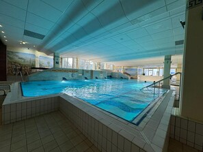 An indoor swimming pool with multiple lanes, tiled walls, and a clear ceiling. - Stressless Forest, including the Bavarian Forest Activity Card, sauna, pool, and fitness center (Sankt Englmar)