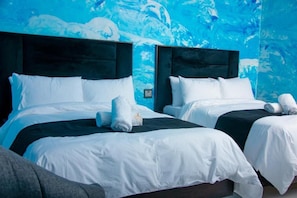 A hotel room with two beds, each with a dark headboard and white bedding. - Meriambase lodge (Johannesburg)